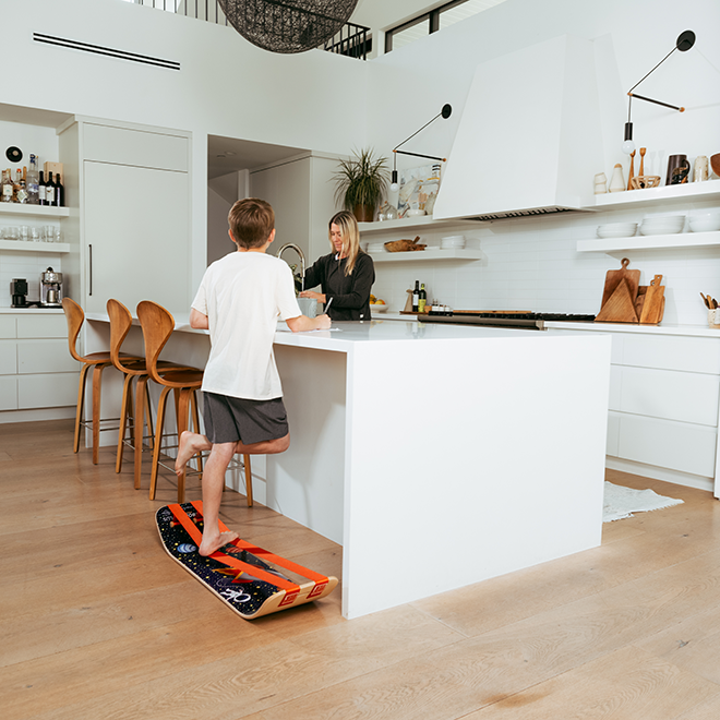 Child using an Astro slackboard plus in a modern kitchen